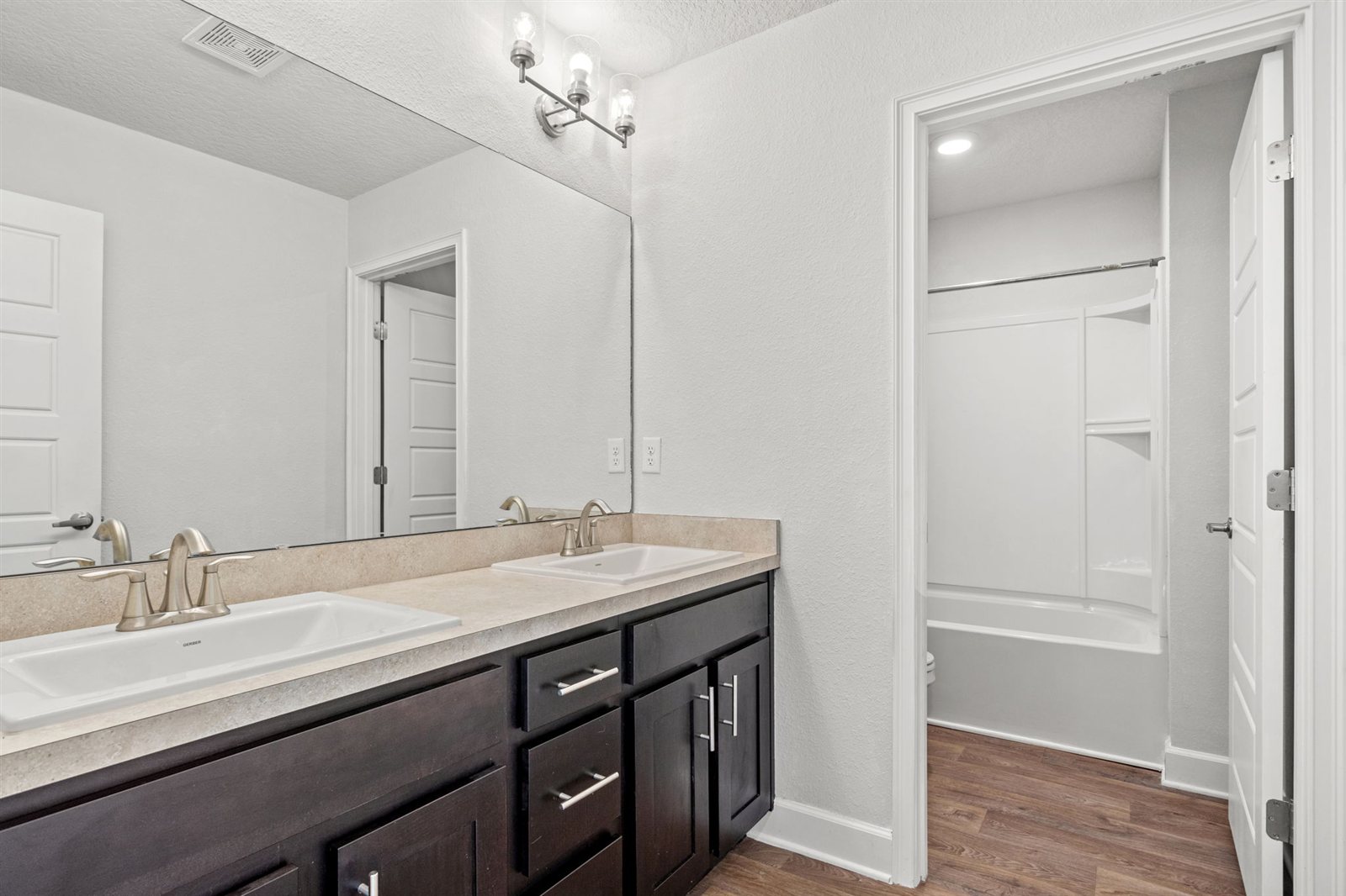 Bathroom vanity and tub at 9956 Redfish Marsh Cir, Jacksonville FL