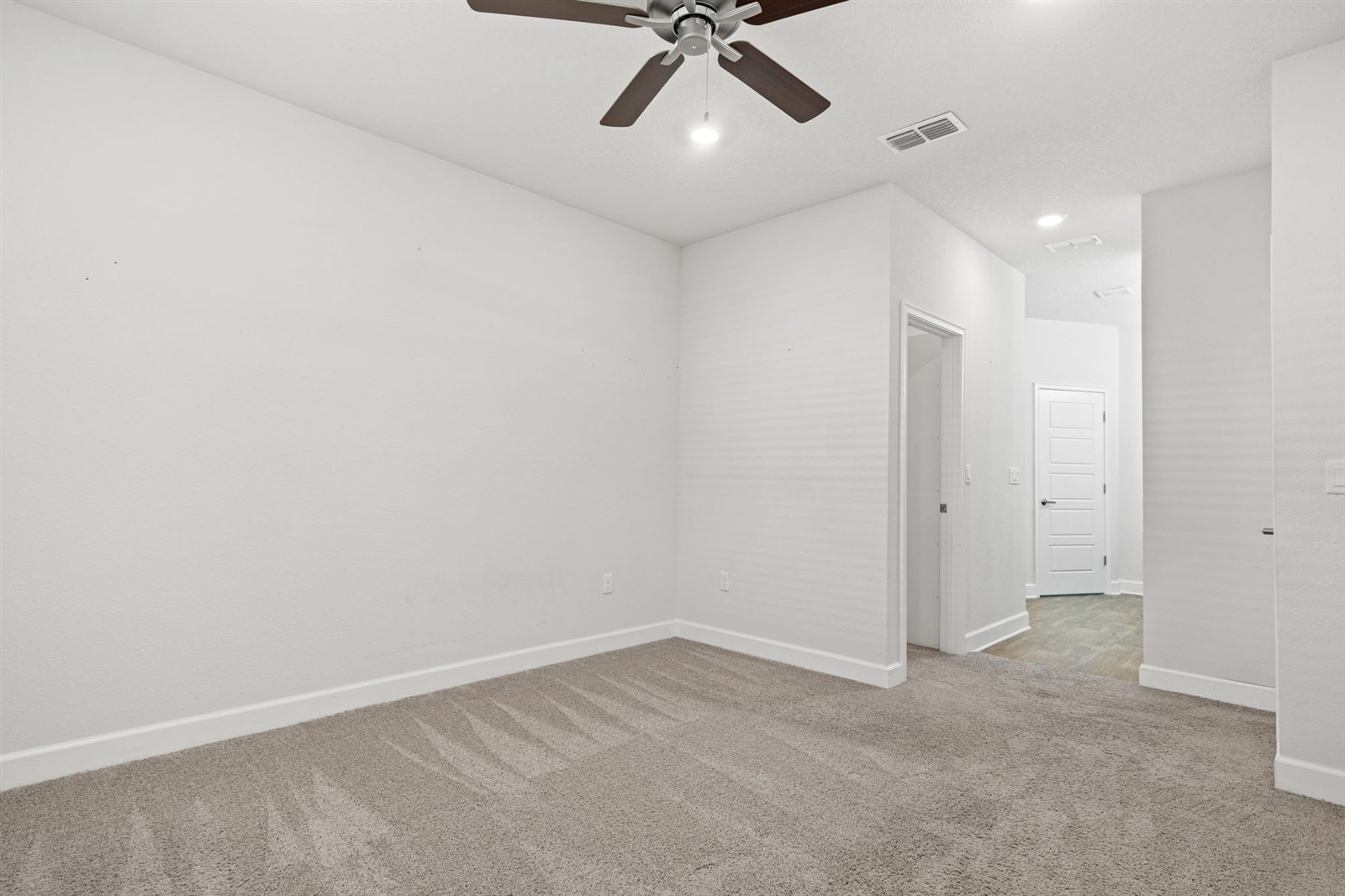 Bedroom and hallway at 9956 Redfish Marsh Cir, Jacksonville FL