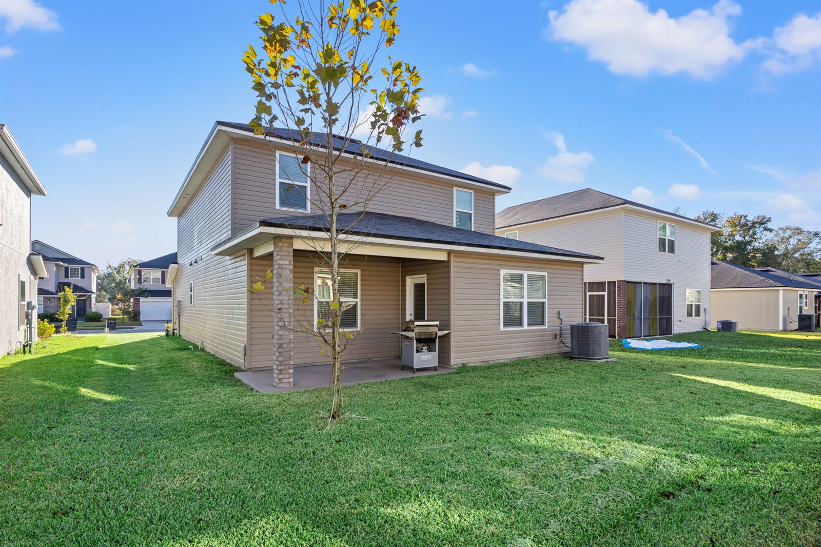 Covered backyard patio at 9956 Redfish Marsh Cir, Jacksonville FL