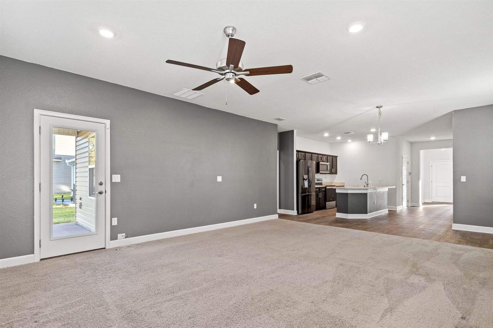 Living area looking toward kitchen at 9956 Redfish Marsh Cir, Jacksonville FL