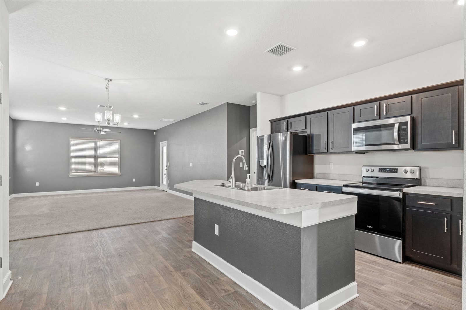 Open kitchen and living area at 9956 Redfish Marsh Cir, Jacksonville FL
