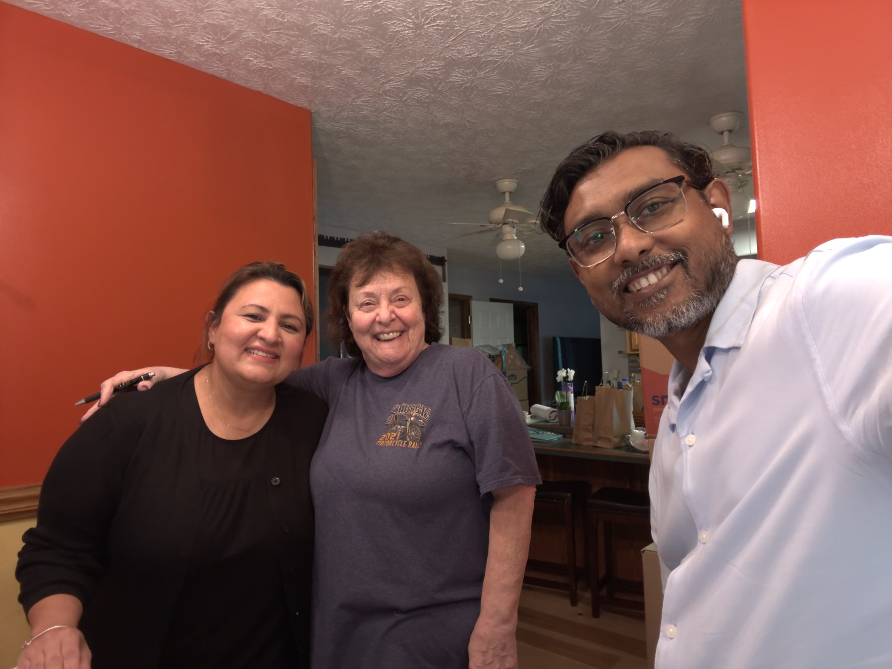 Debbie smiling with the Jitu Investment Group team